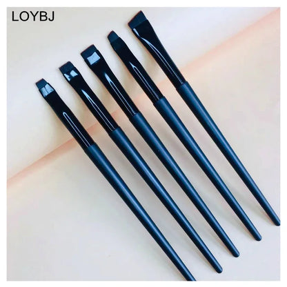Thin angled eyebrow brush with yellow wool fiber bristles flat angled tip wood handle aluminum ferrule 14.0-14.5cm