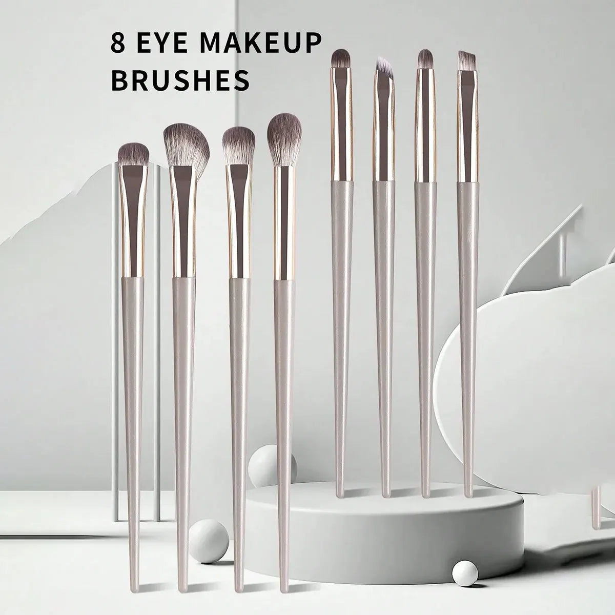 Champagne Wool Eye Brush Set 8 wool-fiber eye brushes with champagne silver plastic handles arranged compactly for travel