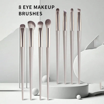 Champagne Wool Eye Brush Set 8 wool-fiber eye brushes with champagne silver plastic handles arranged compactly for travel