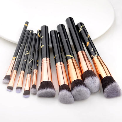 10pc Synthetic Makeup Brushes set with synthetic bristles plastic handles and secure ferrules laid out for full face application