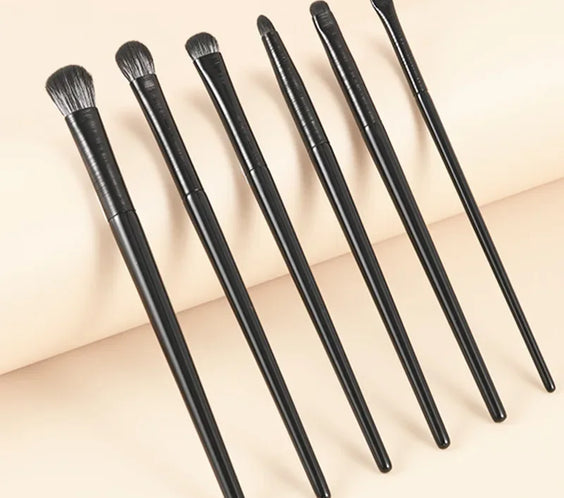 6PCS Wool Fiber Eye Brush Set six brushes with wool fiber bristles and plastic handles laid flat