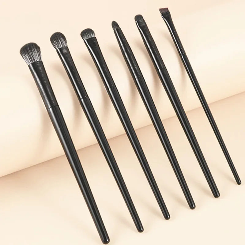 6PCS Wool Fiber Eye Brush Set six brushes with wool fiber bristles and plastic handles laid flat